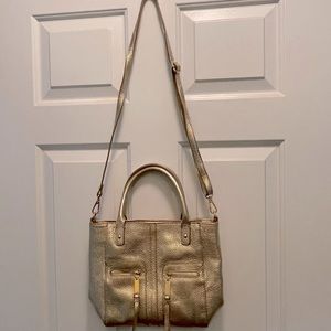 Tommy Hilfiger gold leather purse with shoulder strap.